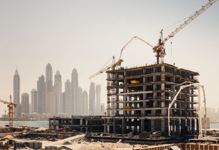 Mechanical technician checking alignment tolerances on heavy industrial process pump