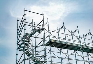 Heavy duty vertical structural shoring jacks supporting temporary overhead concrete framework